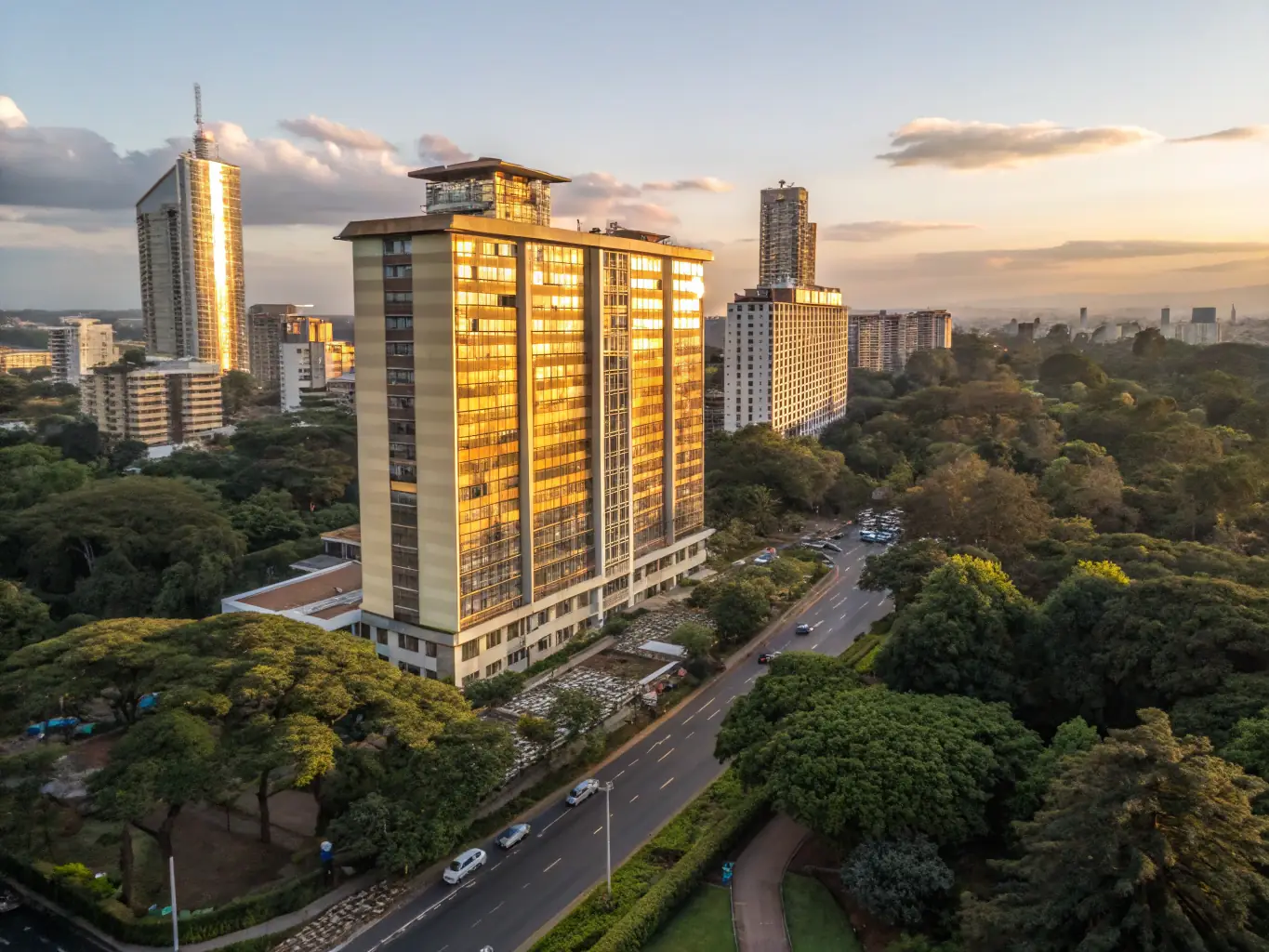 A modern Nairobi apartment with a spacious balcony overlooking the city skyline, showcasing the lifestyle offered by Nova Stay Homes' property sales.