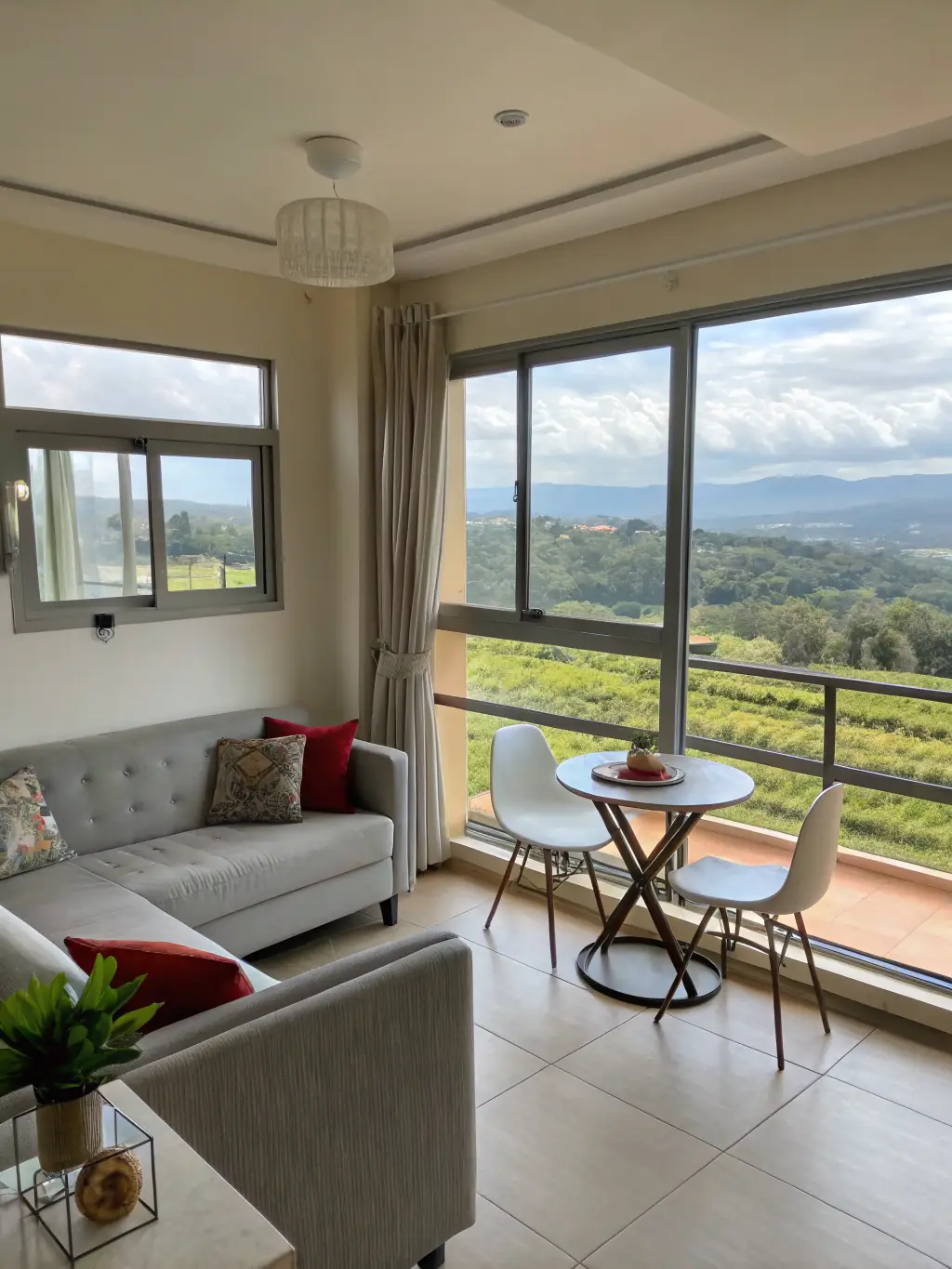 A modern apartment interior in Nairobi, Kenya, showcasing an open-plan living space with large windows, contemporary furniture, and stylish decor, emphasizing the urban living experience offered by Nova Stay Homes.